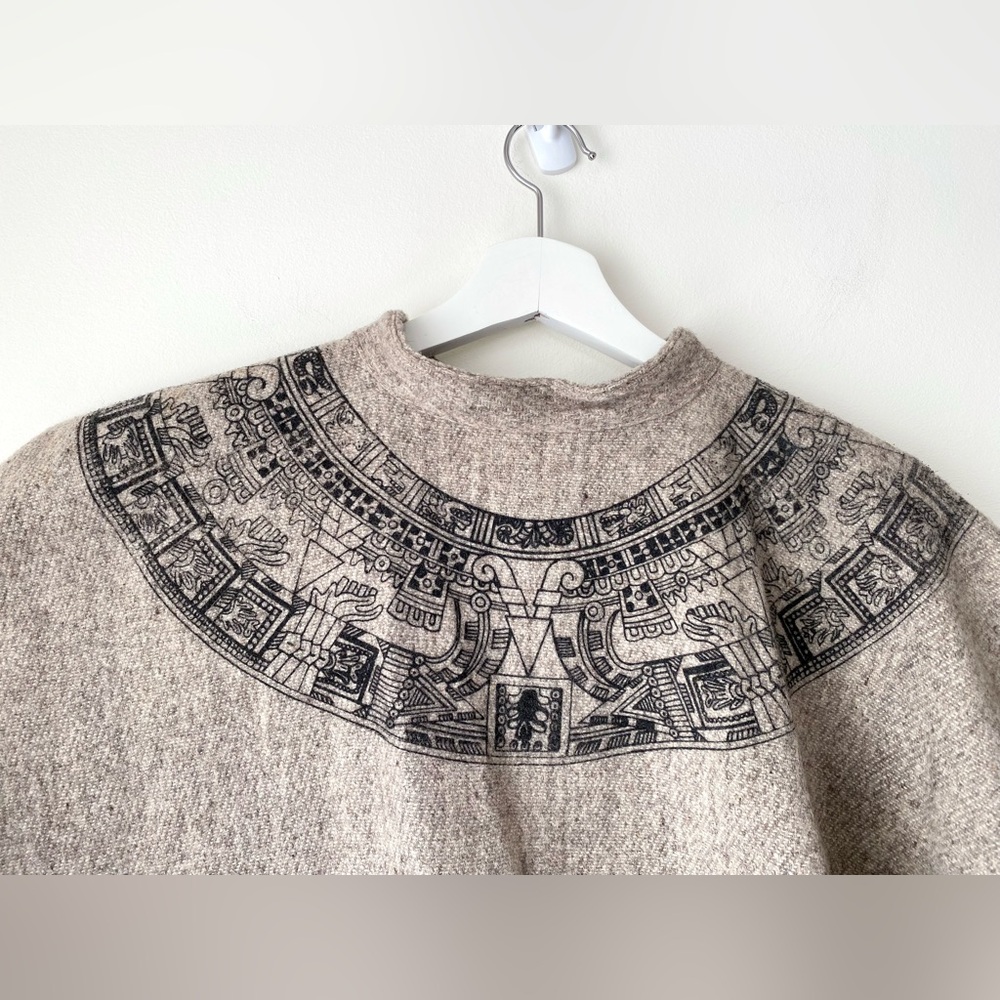 Fringed hem poncho with Egyptian-look print around collar - Picture 13 of 13